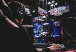 An image of a gamer playing videogames on a PC