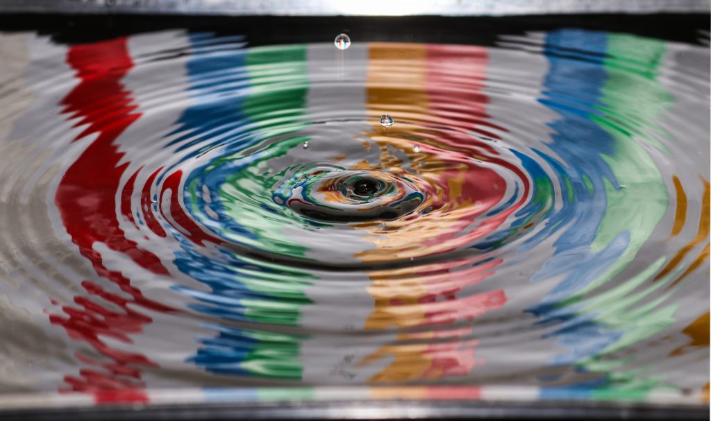 The LGBTQ+ flag reflection in Holy Water represents Hallmark's inclusion of LGBTQ content regardless of it being a Christian-owned network.