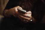 in article about the online casino, a person on their phone
