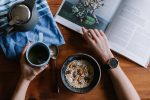 in an article about developing healthy habits, a person with coffee and a bowl of cereal