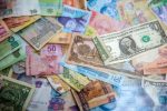 various currencies in article about opening an online casino