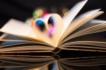 A heart shaped from 2 pages in a book to represent the upcoming new release of The Ballad of Never After.