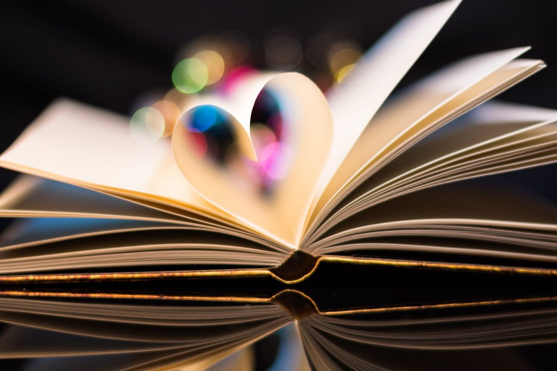 A heart shaped from 2 pages in a book to represent the upcoming new release of The Ballad of Never After.