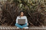 in an article about students who get injured, a person sitting down with their laptop