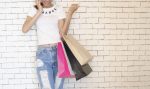 In an article about summer fashion trends, an image of a girl shopping.