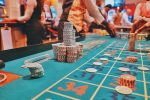 in an article about gambling Australians, people around a roulette table