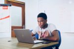 someone studying at a laptop