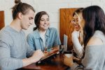four college students conversing