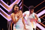 A screenshot from dancing with the stars shows two individuals smiling together
