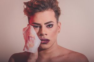 drag performer removing makeup