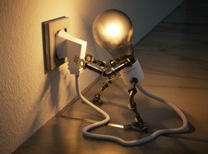 In an article about the motivation formula, a lightbulb man plugs something into a wall socket
