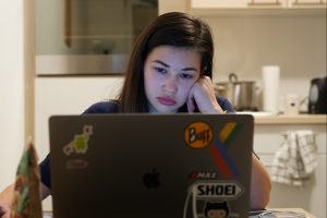 in article about academic burnout, a young person staring at their computer screen
