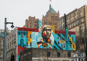 in an article about the importance of voting a voter rights mural ia featured on a city building
