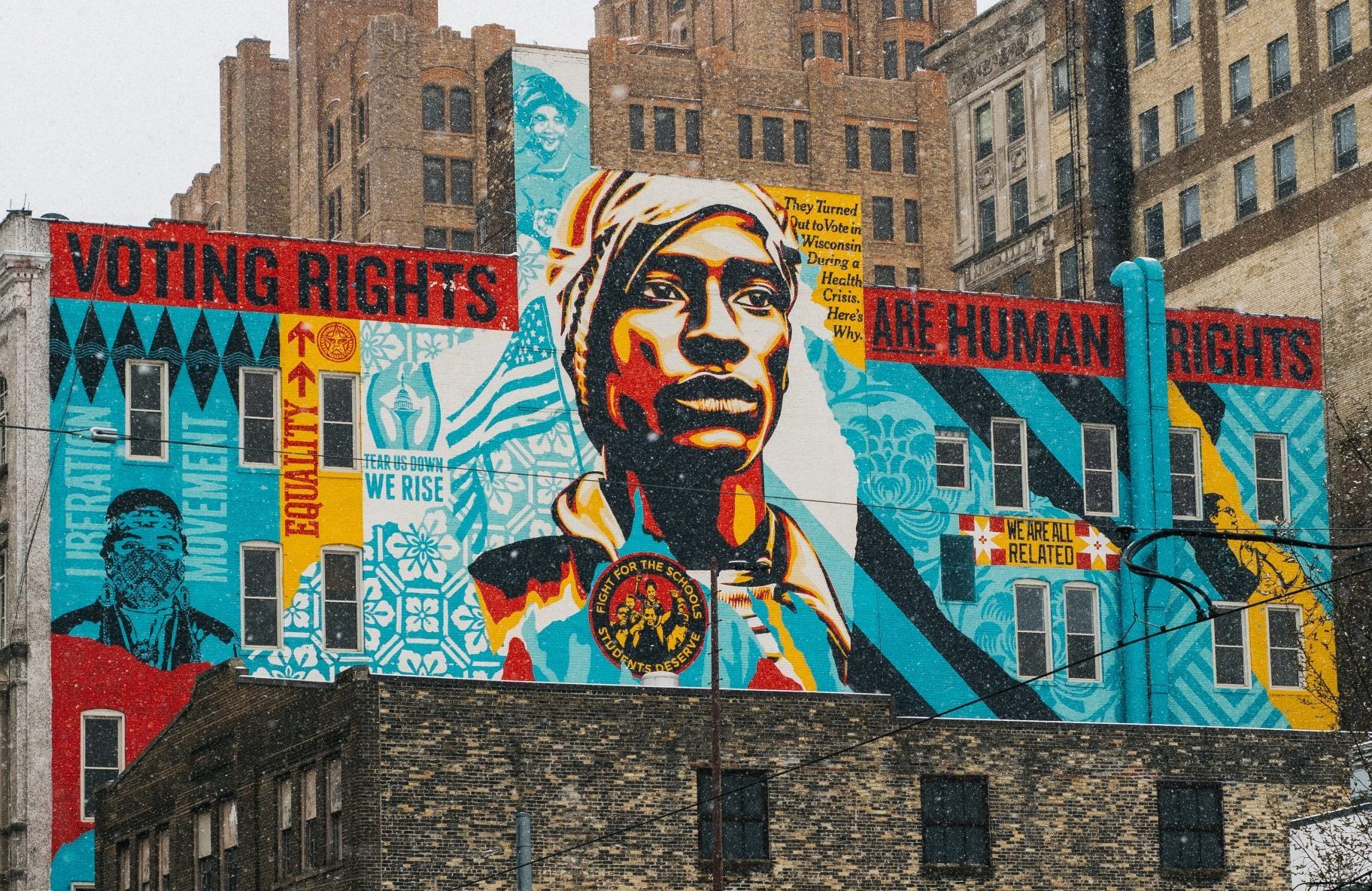 in an article about the importance of voting a voter rights mural ia featured on a city building