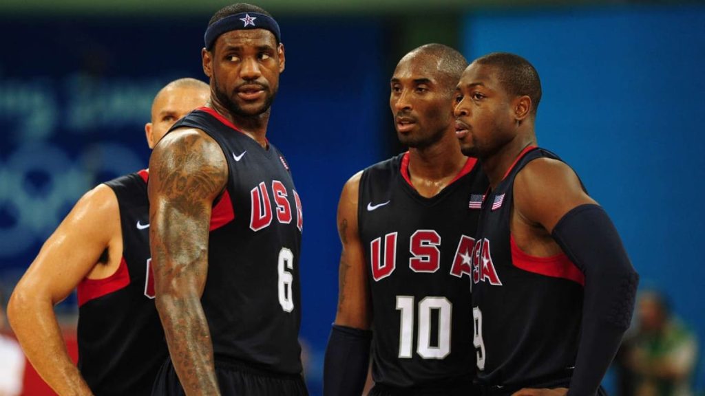 A screenshot from the redeem team documentary shows several members of the team standing in a group