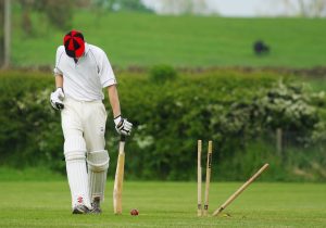 a man playing cricket