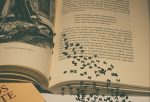 in an article about classic literaturean open book with work spilling from the pages