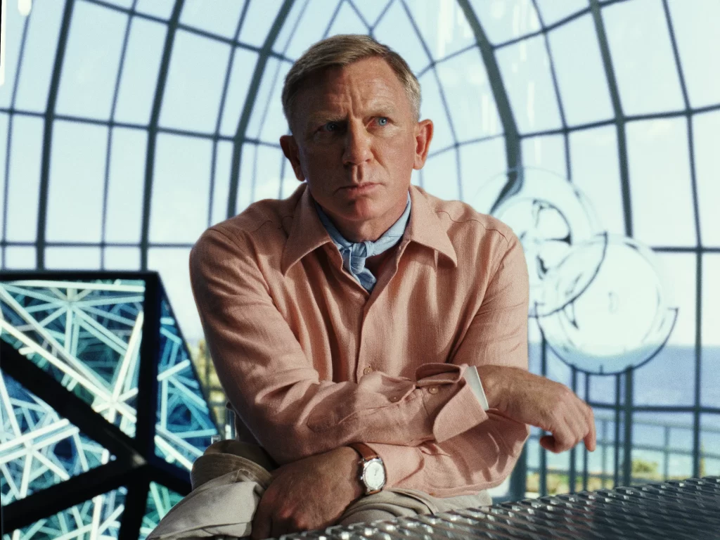 In an article about the film 'Glass Onion: A Knives Out Mystery' Detective Benoit Blanc stares out pensively.