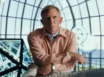 In an article about the film 'Glass Onion: A Knives Out Mystery' Detective Benoit Blanc stares out pensively.