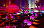 In a piece about Stake.us online casino, the inside of a dimly lit casino.