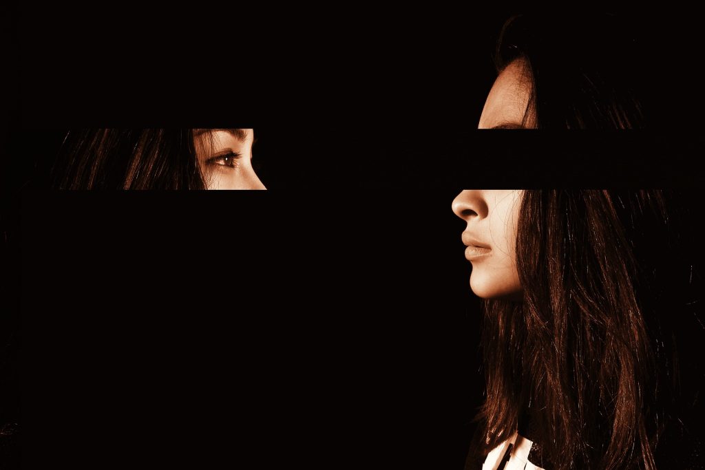 In an article about how Latinas experience eating disorders, a picture of a woman staring at her own reflection.
