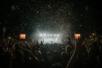 In an article about Travis Scott, a crowd of people at a concert.