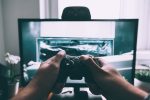 In an article about slingo, a man plays computer games.