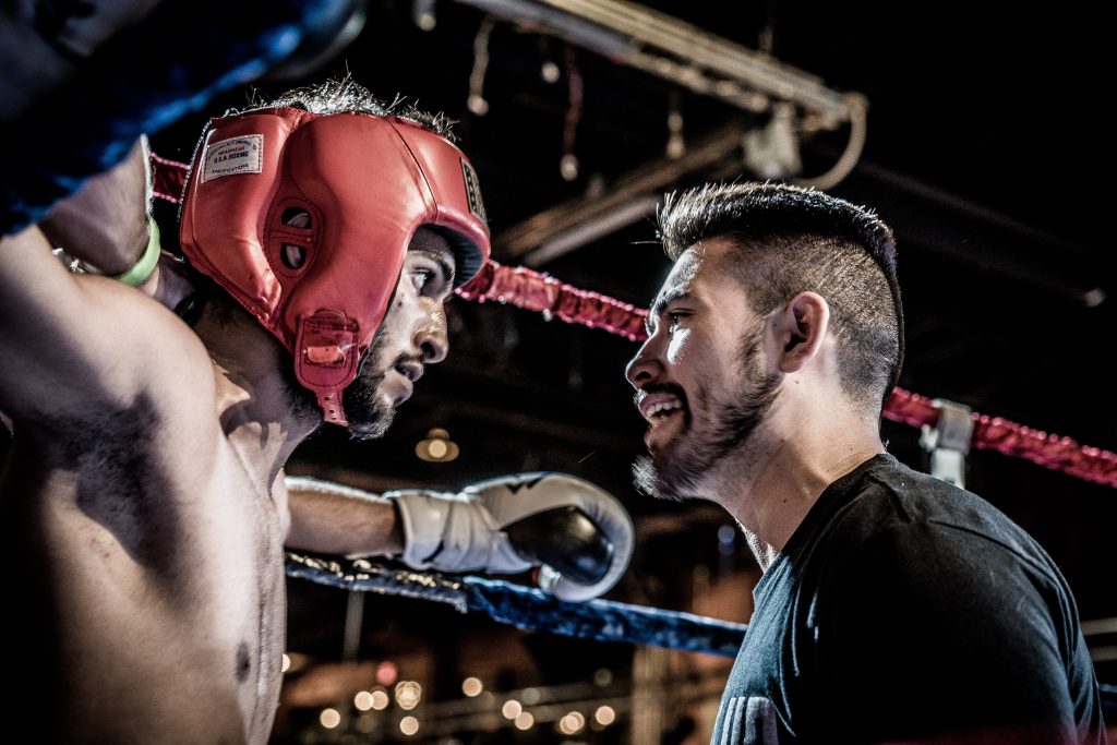 In an article about MMA, a coach talks to his boxer during a time-out.