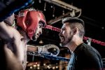 In an article about MMA, a coach talks to his boxer during a time-out.
