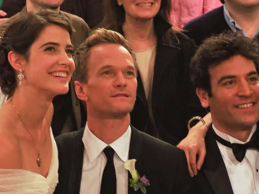 In an article about the series finale of "How I Met Your Mother," a picture of three of the main characters, Robin, Barney, and Ted