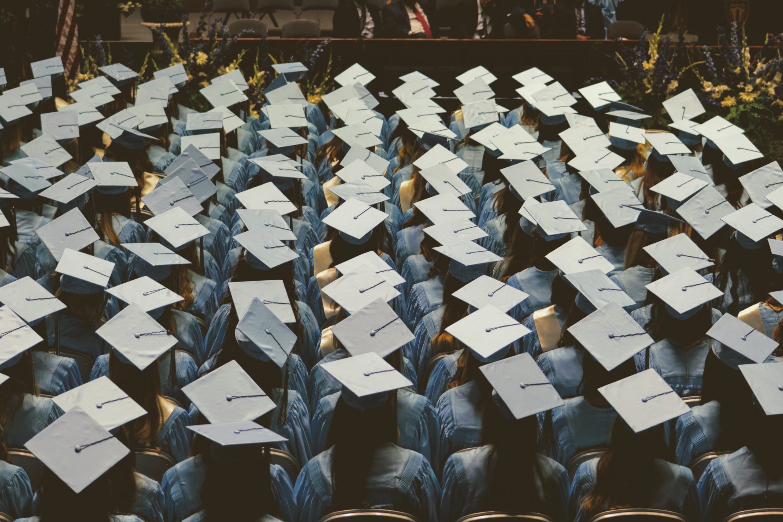 In an article about graduation, a sea of graduates at a commencement ceremony.