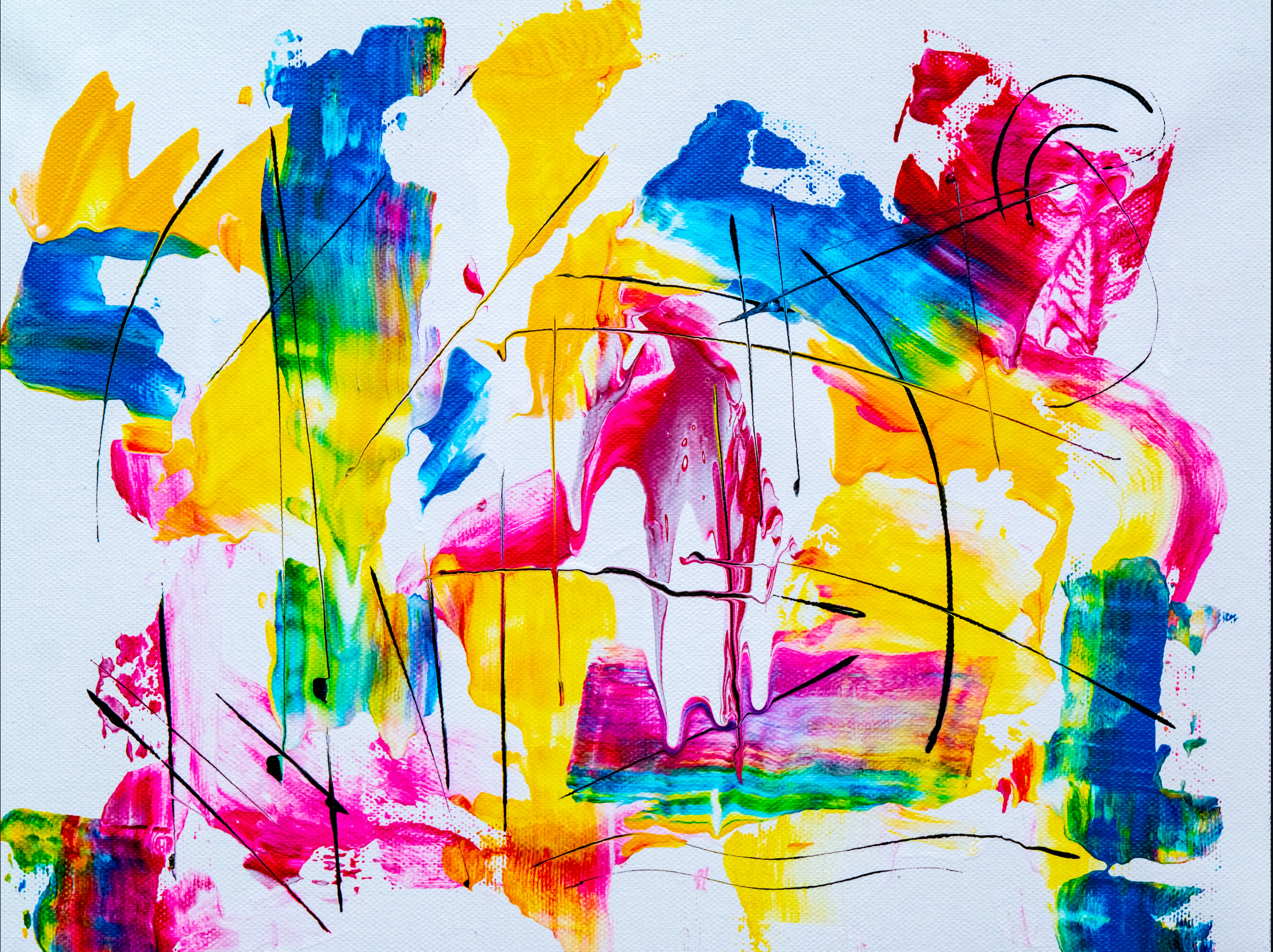 Yellow, blue, pink, and green hues splattered against a white canvas.