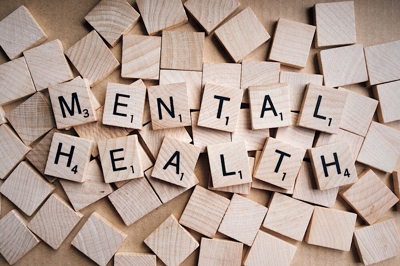 In an article about mental health. Mental health written out with scrabble pieces.