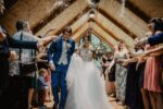 In a story about wedding planning a couple walking down the aisle.