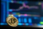 Bitcoin floating in front of computer screen with trading graph