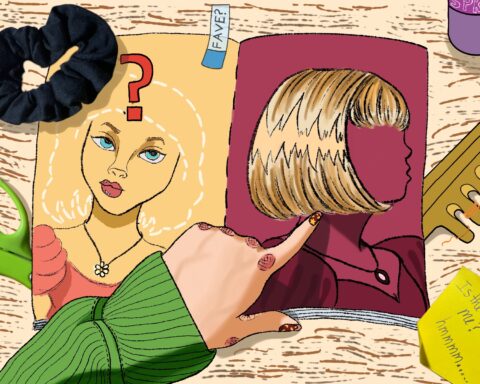 For an article on the history of the bob hairstyle, a magazine is open on an image of a women with an outline across her head that indicates hair. An offscreen figure points to the opposite page, where a blonde cutout bob hairstyle is present.