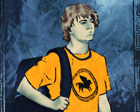 For an article about the Percy Jackson TV series, a boy with mid-length brown hair wears a bright orange-yellow shirt with a pegasus (winged horse) on it while carrying a dark backpack. He stands against a blue, water-like, crinkly paper background with a Greek-style border along the left and right side.