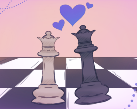 Against a pink background, a tan queen and a black king chess piece leans towards one another on a chess board with purple hearts in between them.