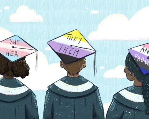 Three people stand against a backdrop of the open sky, dressed in black graduation gowns. The audience can clearly see their hair -- short and curly in buns on the far left, brown-blonde in the center, black and braided at the right -- and their caps, festooned with various pride flags representing different identities, such as trans or nonbinary.