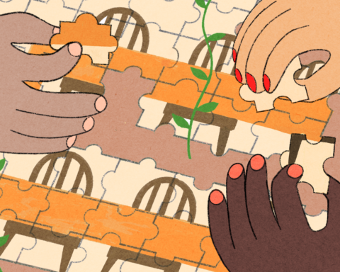 Different hands coming together to build a puzzle.