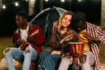 Men and women playing Ukelele and Bongo