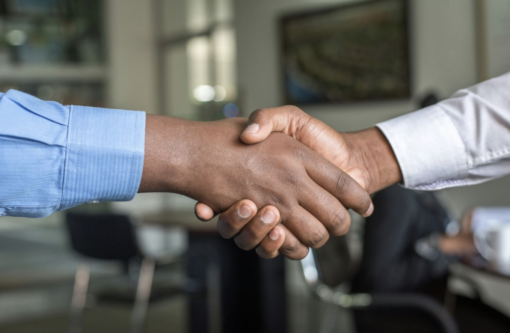 https://unsplash.com/photos/two-people-shaking-hands-n95VMLxqM2I